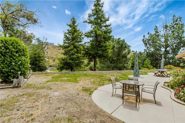 a view of a yard with furniture