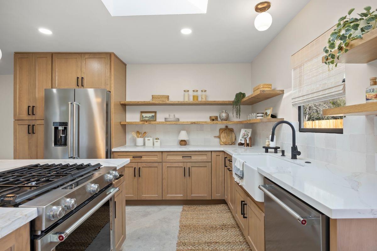 283 Burnham Road Oak View, CA 93022 - Photo 2 of 13 a kitchen with stainless steel appliances granite countertop a sink stove and refrigerator