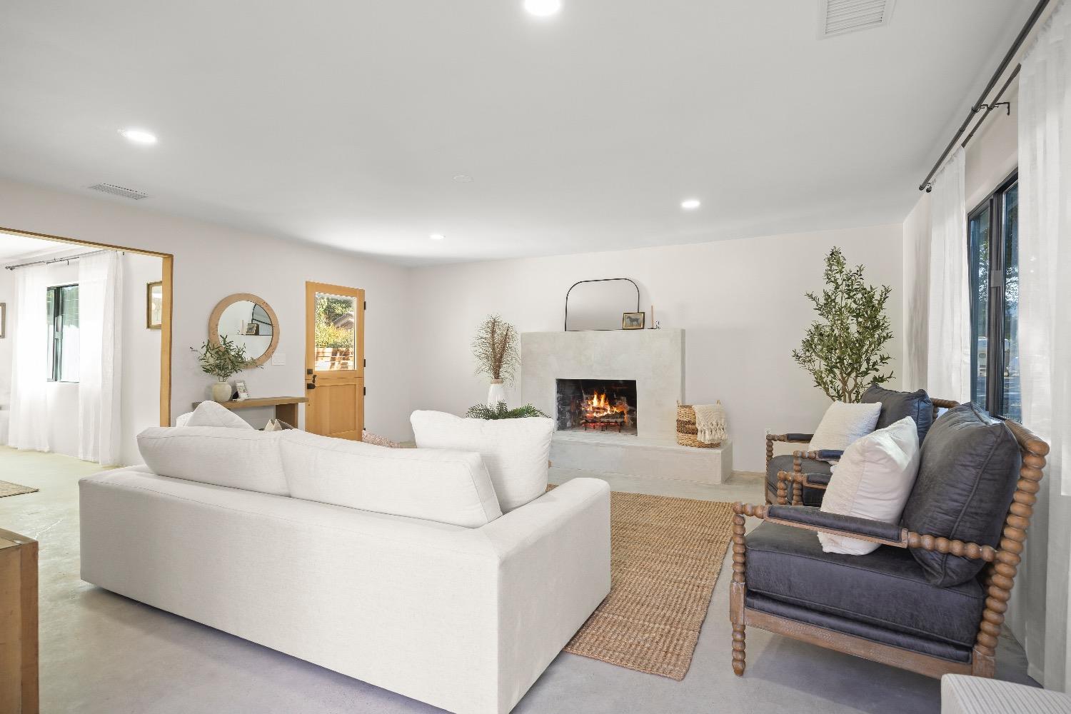 283 Burnham Road Oak View, CA 93022 - Photo 3 of 13 a living room with furniture and a fireplace