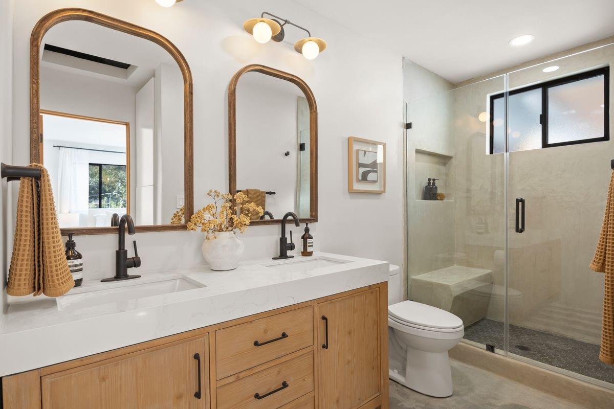 283 Burnham Road Oak View, CA 93022 - Photo 8 of 13 a bathroom with a double vanity sink toilet and shower