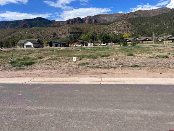 a view of a town with mountains in the background