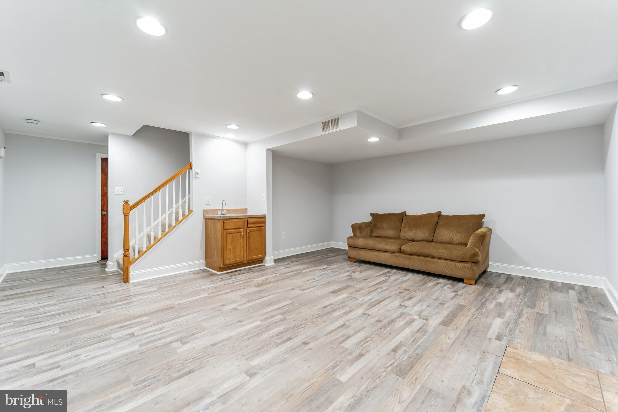 1012 B And L Club Road Pasadena, MD 21122 - Photo 33 of 54 Basement level family room