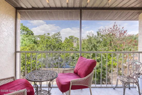a outdoor dining space with furniture and outdoor view