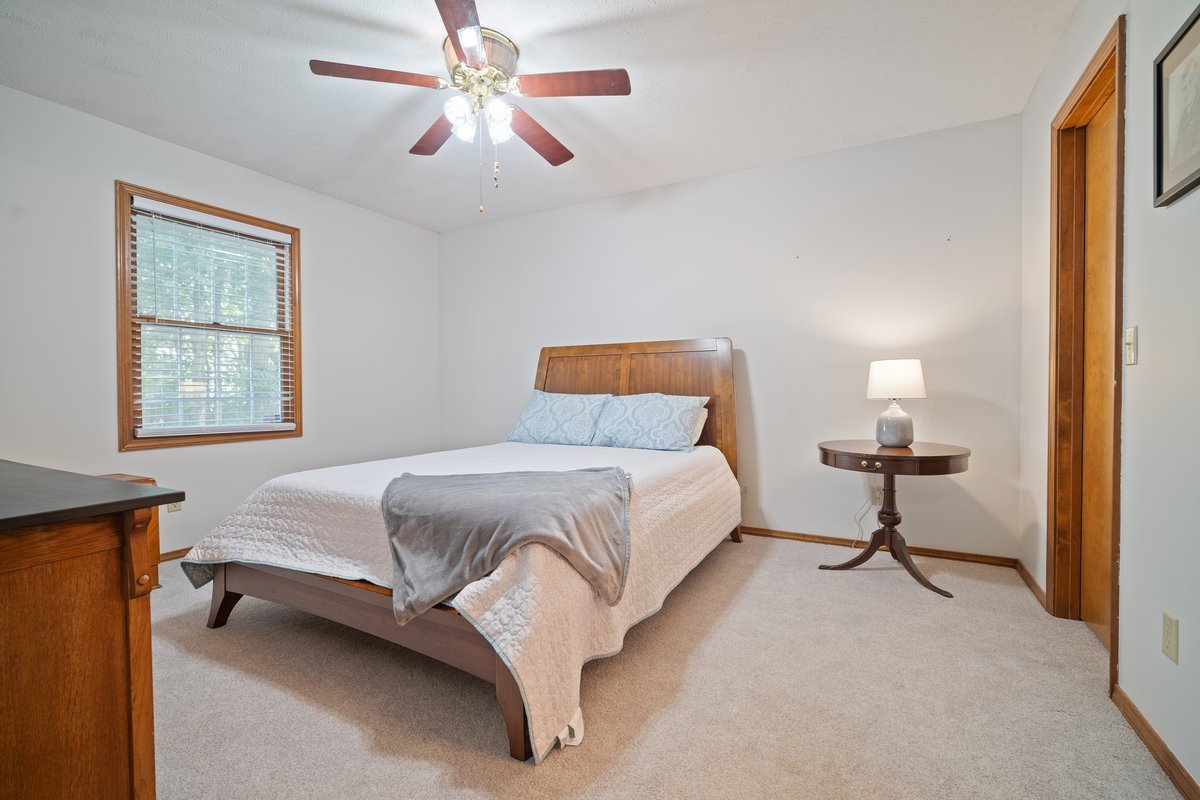 2606 Persimmon Place Bloomington, IL 61701 - Photo 12 of 19 a bedroom with a bed and window