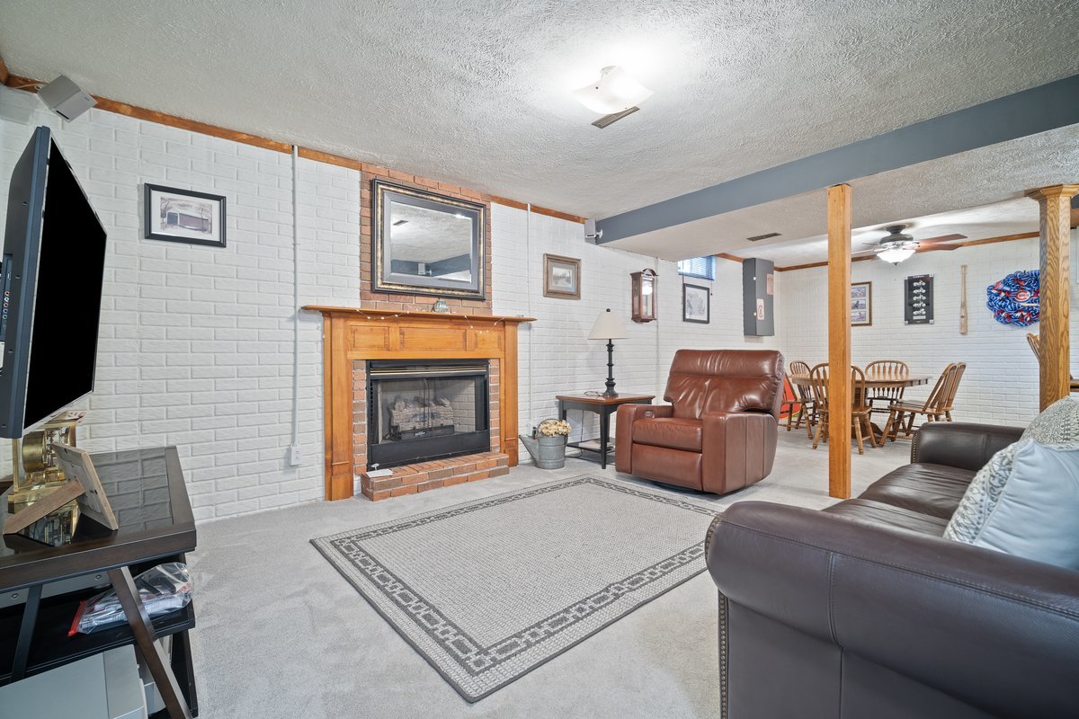 2606 Persimmon Place Bloomington, IL 61701 - Photo 15 of 19 a living room with furniture and a fireplace