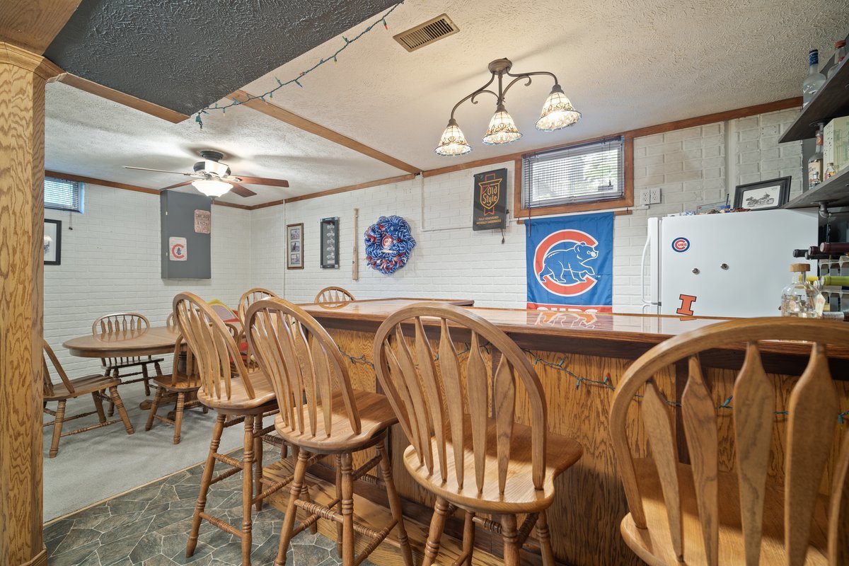 2606 Persimmon Place Bloomington, IL 61701 - Photo 16 of 19 a view of a dining room with furniture and chandelier