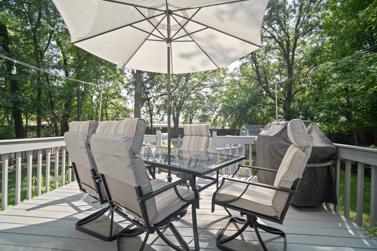 2606 Persimmon Place Bloomington, IL 61701 - Photo 19 of 19 a view of a patio with a table chairs and a umbrella