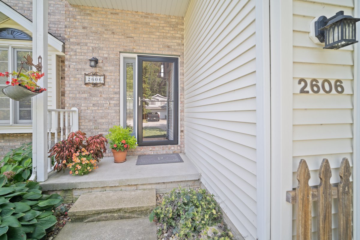 2606 Persimmon Place Bloomington, IL 61701 - Photo 2 of 19 a view of a house with potted plants