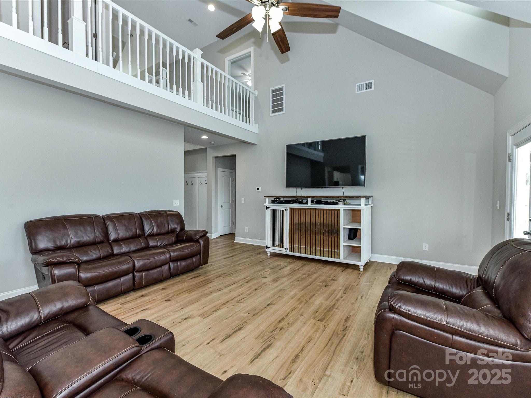 899 Hasty Road Marshville, NC 28103 - Photo 13 of 44 a living room with furniture and a flat screen tv