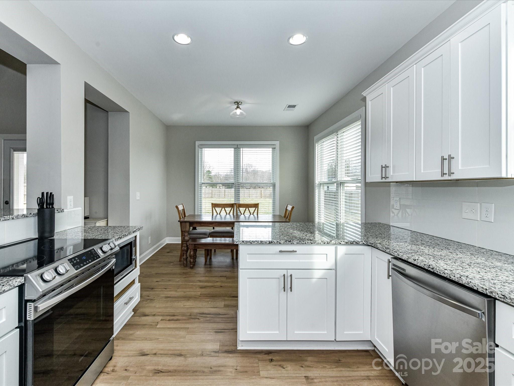 899 Hasty Road Marshville, NC 28103 - Photo 16 of 44 a kitchen with a sink stove and cabinets