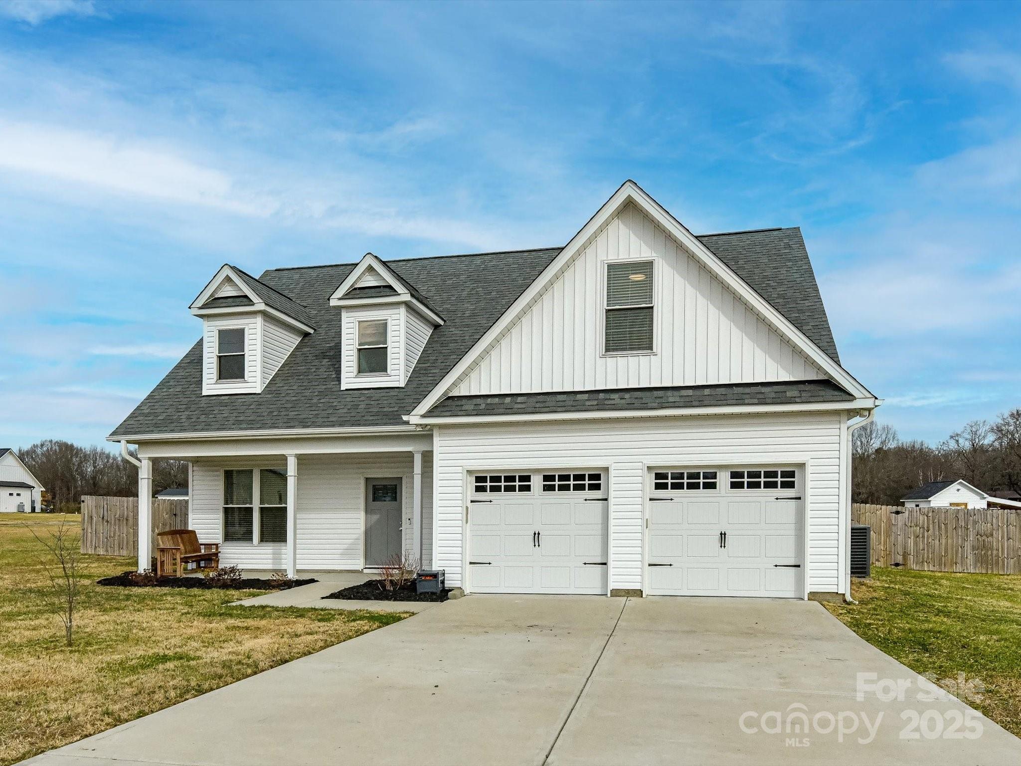899 Hasty Road Marshville, NC 28103 - Photo 2 of 44 a front view of a house with a yard