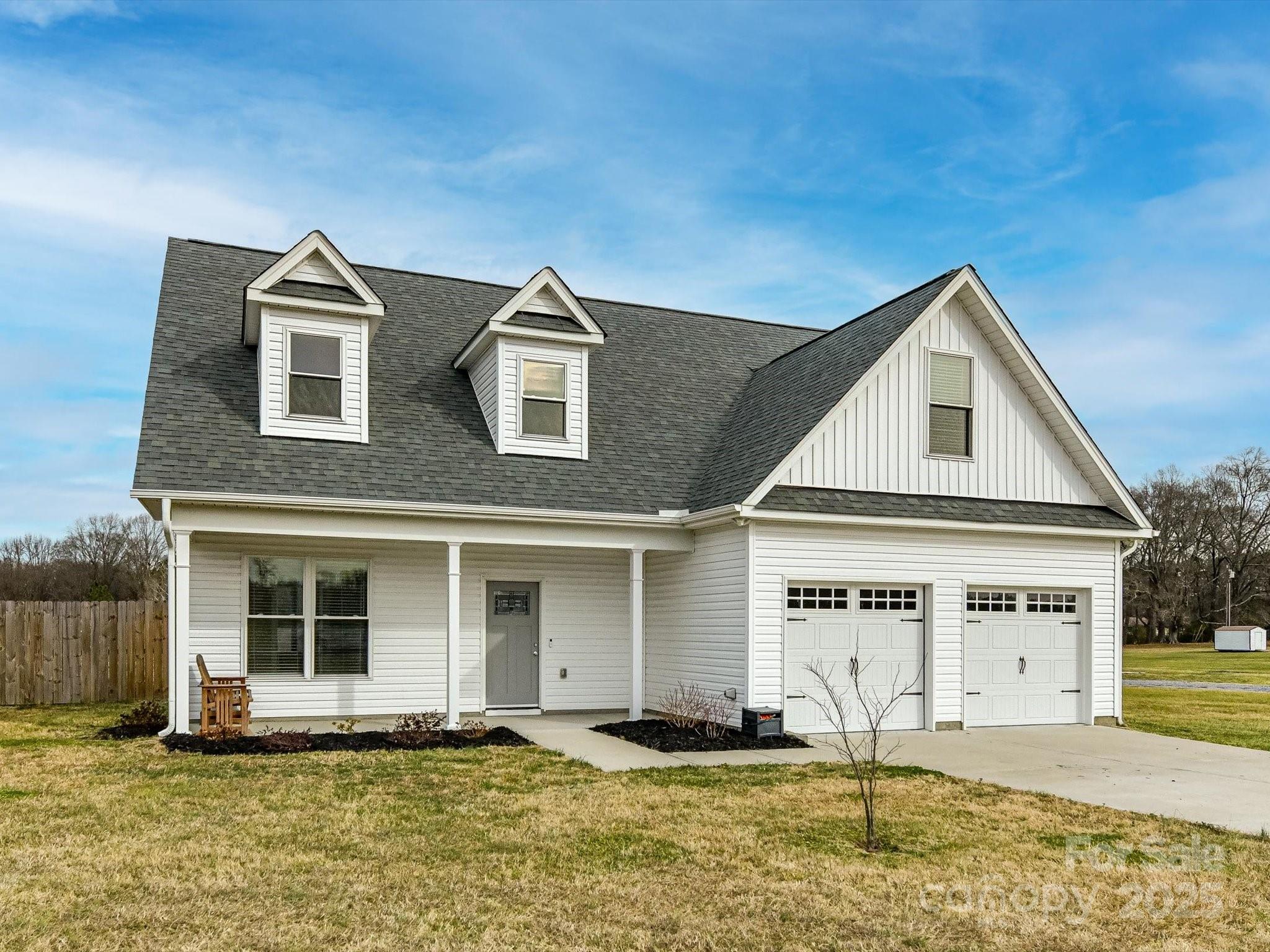 899 Hasty Road Marshville, NC 28103 - Photo 3 of 44 a front view of a house with a yard