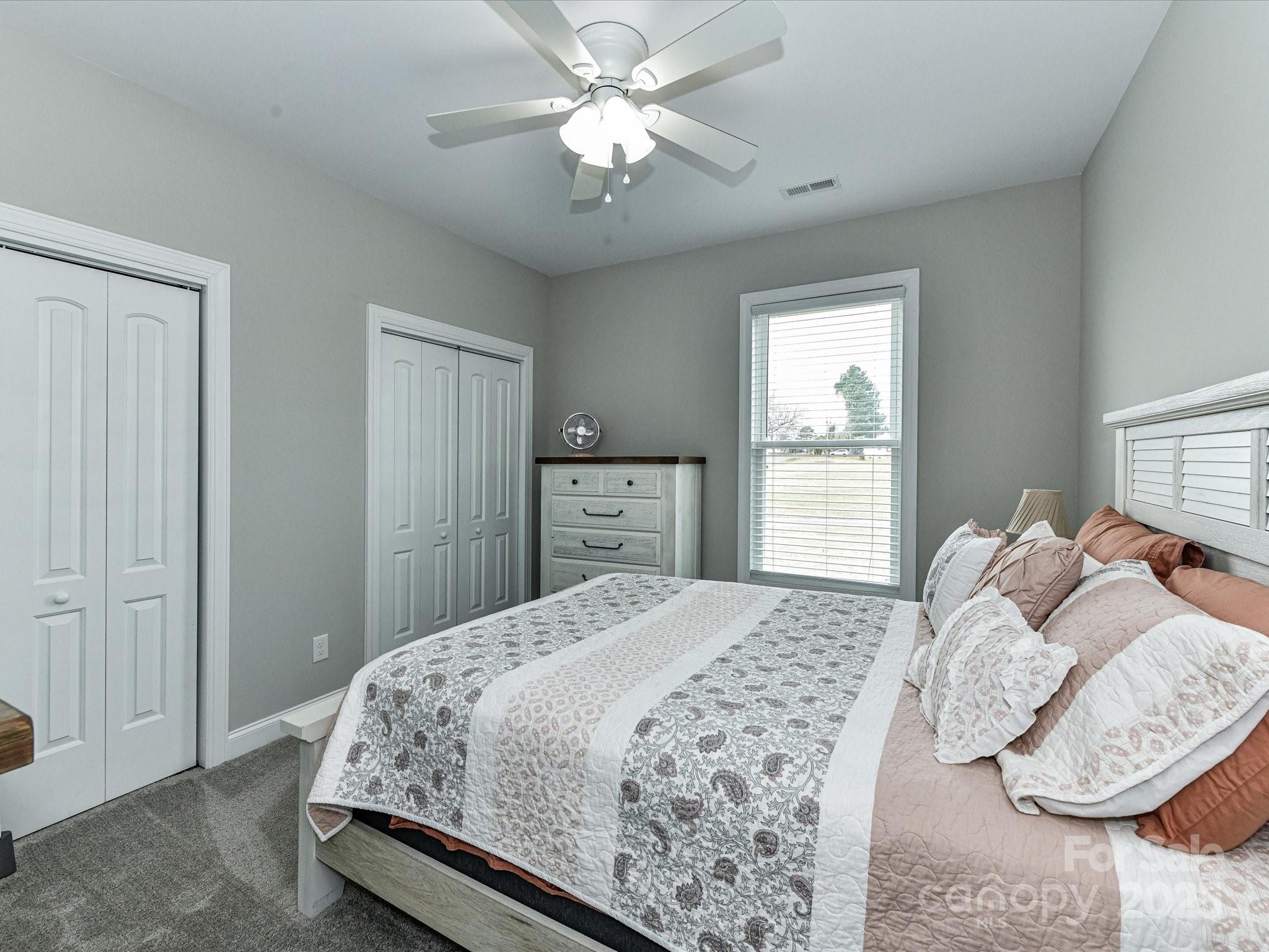 899 Hasty Road Marshville, NC 28103 - Photo 32 of 44 a bedroom with a bed and a window