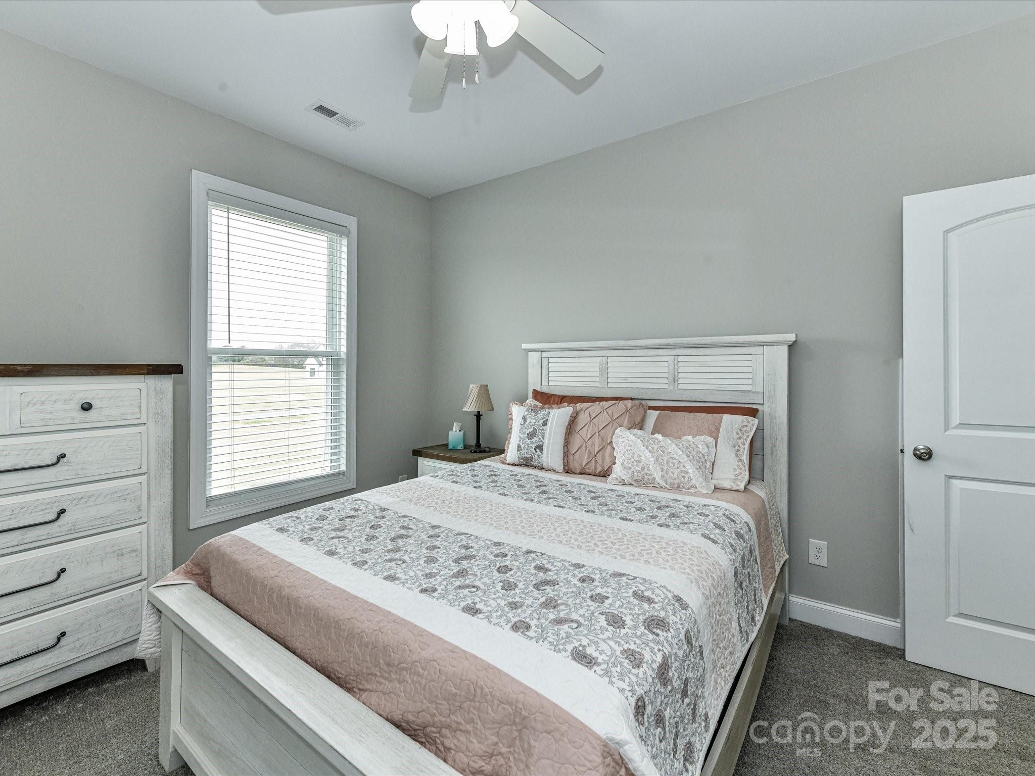 899 Hasty Road Marshville, NC 28103 - Photo 33 of 44 a bedroom with a bed and a window