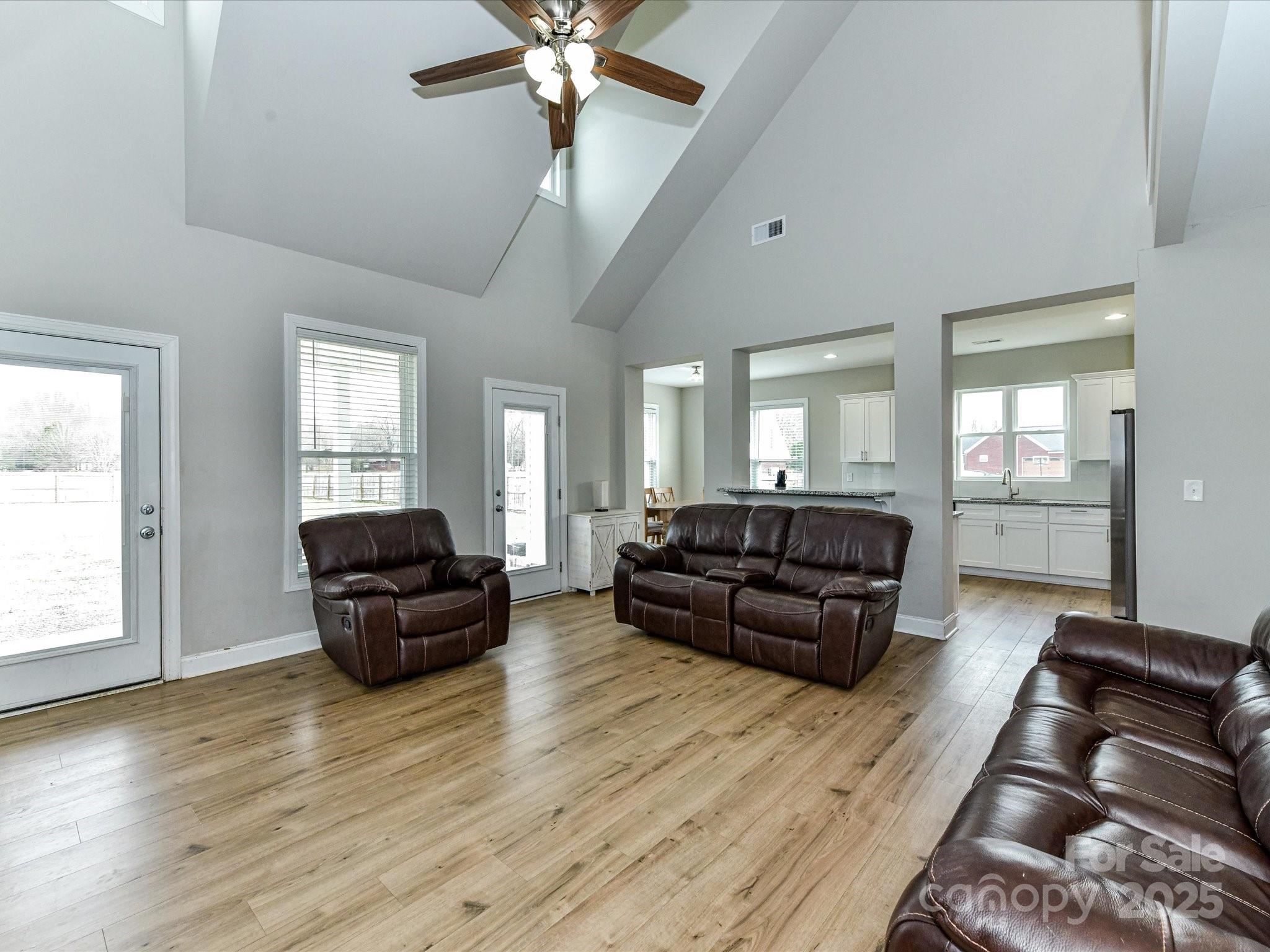 899 Hasty Road Marshville, NC 28103 - Photo 10 of 44 a living room with furniture and a wooden floor
