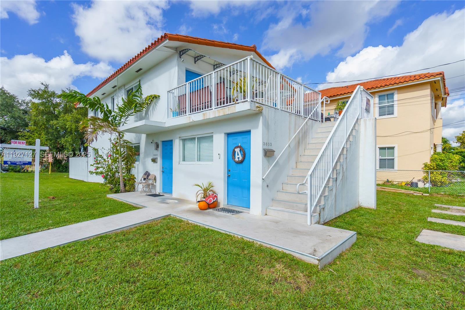 a front view of a house with garden