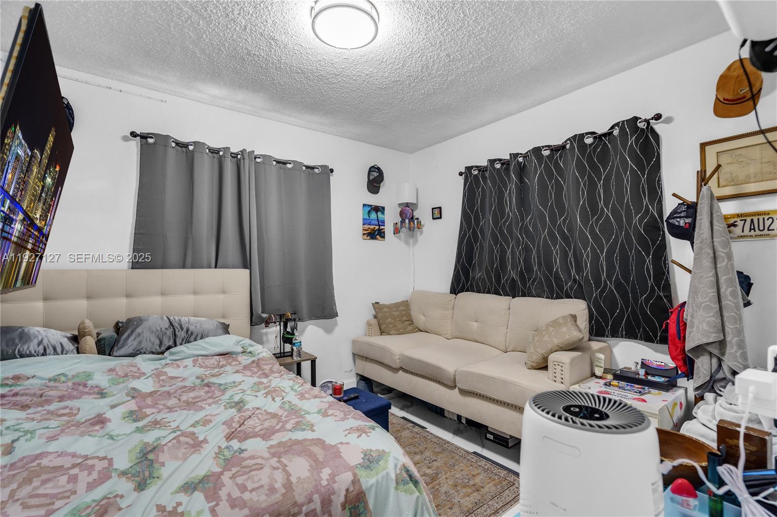 3601 Southwest 2nd Street, Unit 3601 Miami, FL 33135 - Photo 11 of 21 a bedroom with bed and a couch