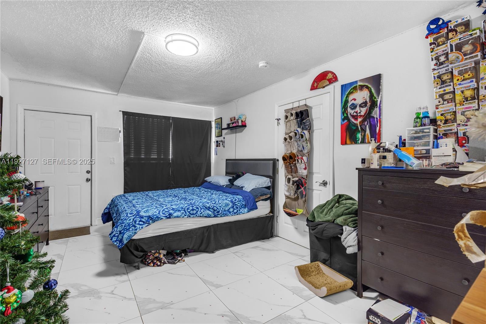 3601 Southwest 2nd Street, Unit 3601 Miami, FL 33135 - Photo 15 of 21 a bedroom with a bed and a dresser