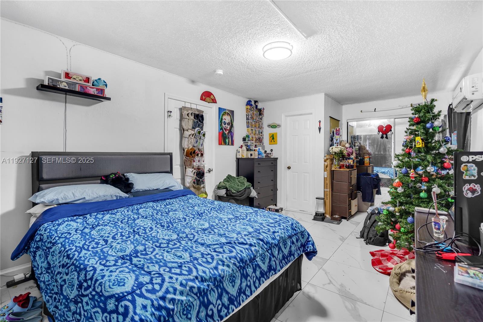 3601 Southwest 2nd Street, Unit 3601 Miami, FL 33135 - Photo 16 of 21 a bedroom with bed and a potted plant