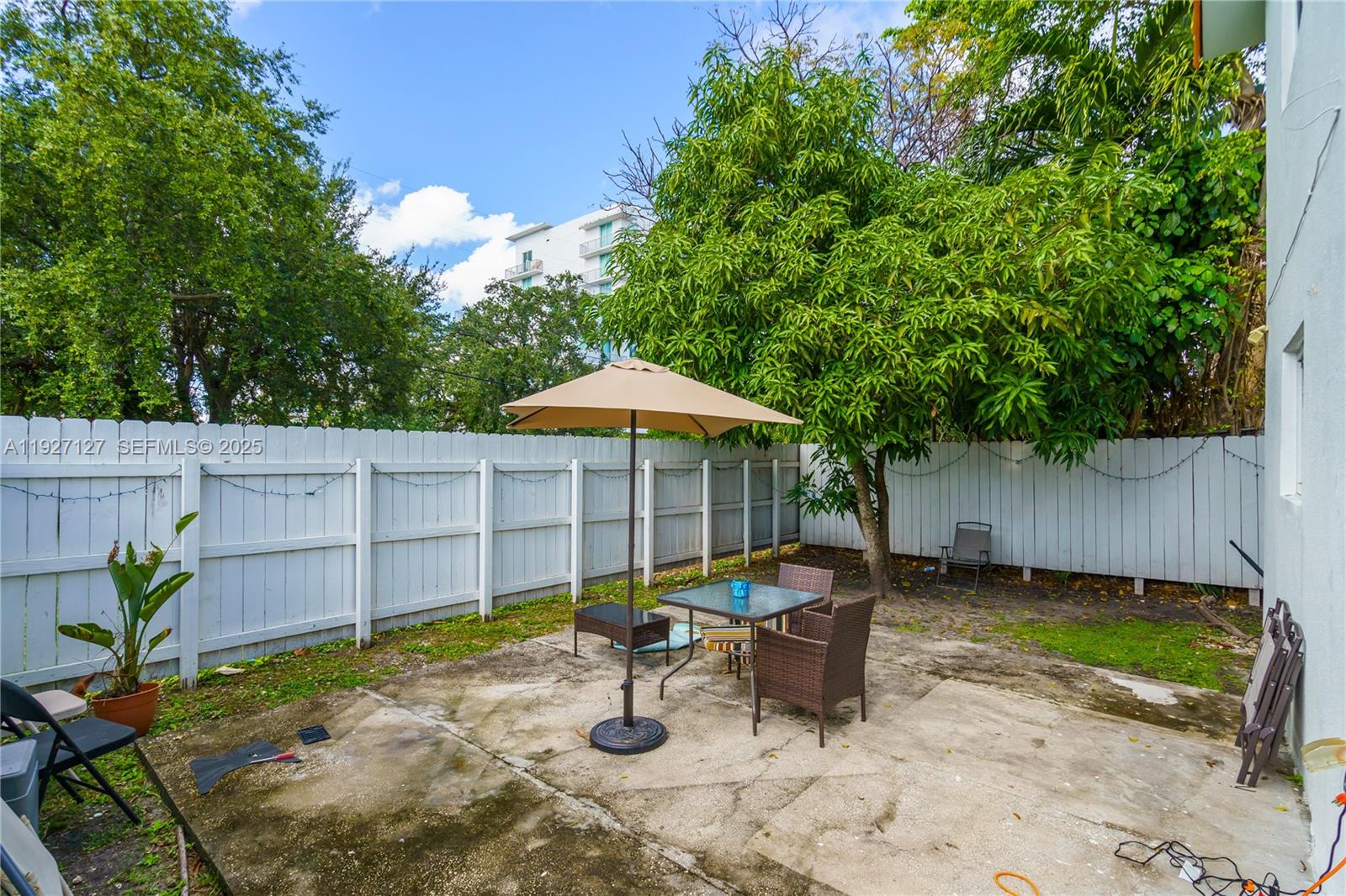 3601 Southwest 2nd Street, Unit 3601 Miami, FL 33135 - Photo 17 of 21 a view of a backyard with a sitting area and furniture