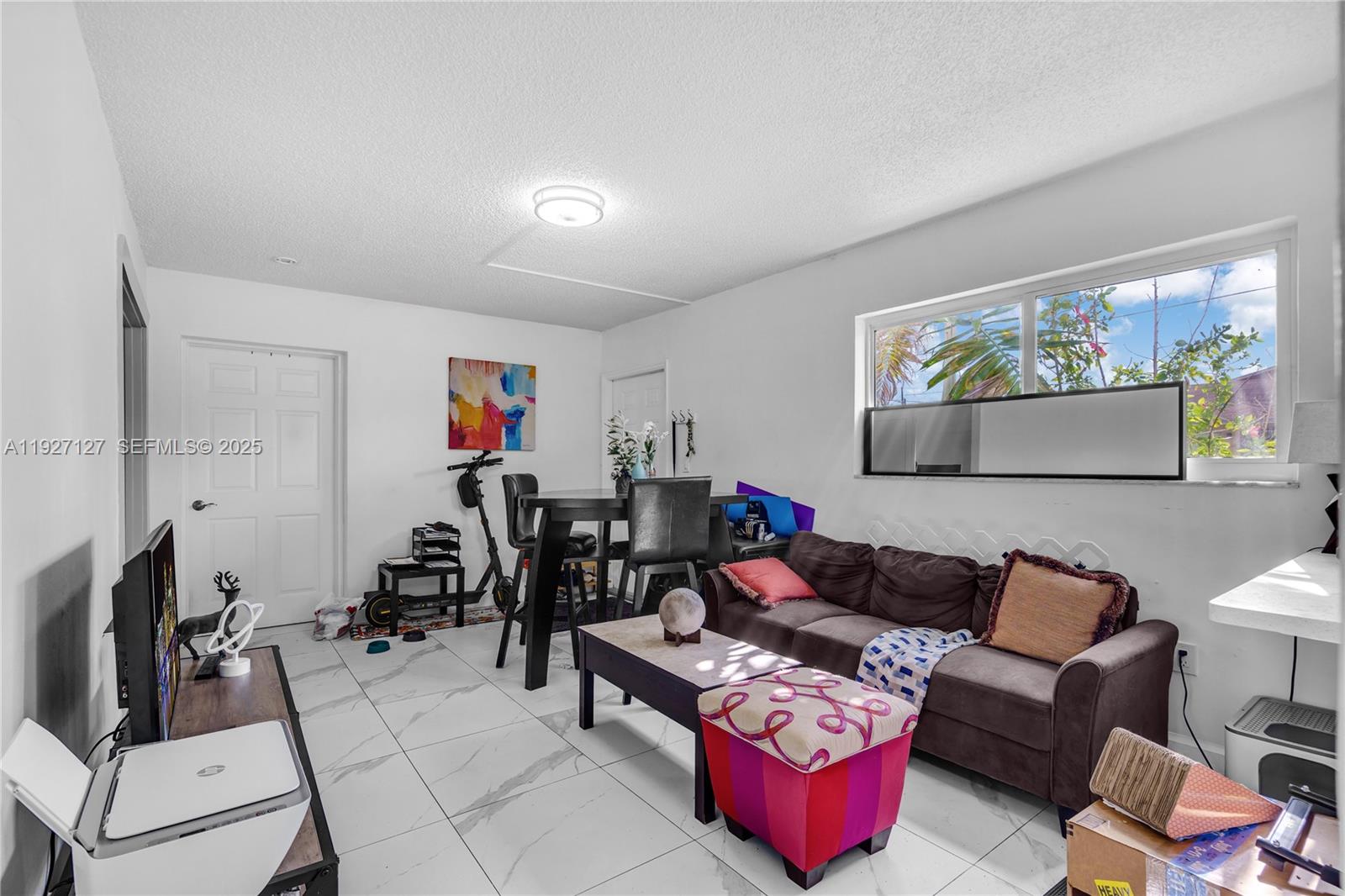 3601 Southwest 2nd Street, Unit 3601 Miami, FL 33135 - Photo 5 of 21 a living room with furniture and a flat screen tv