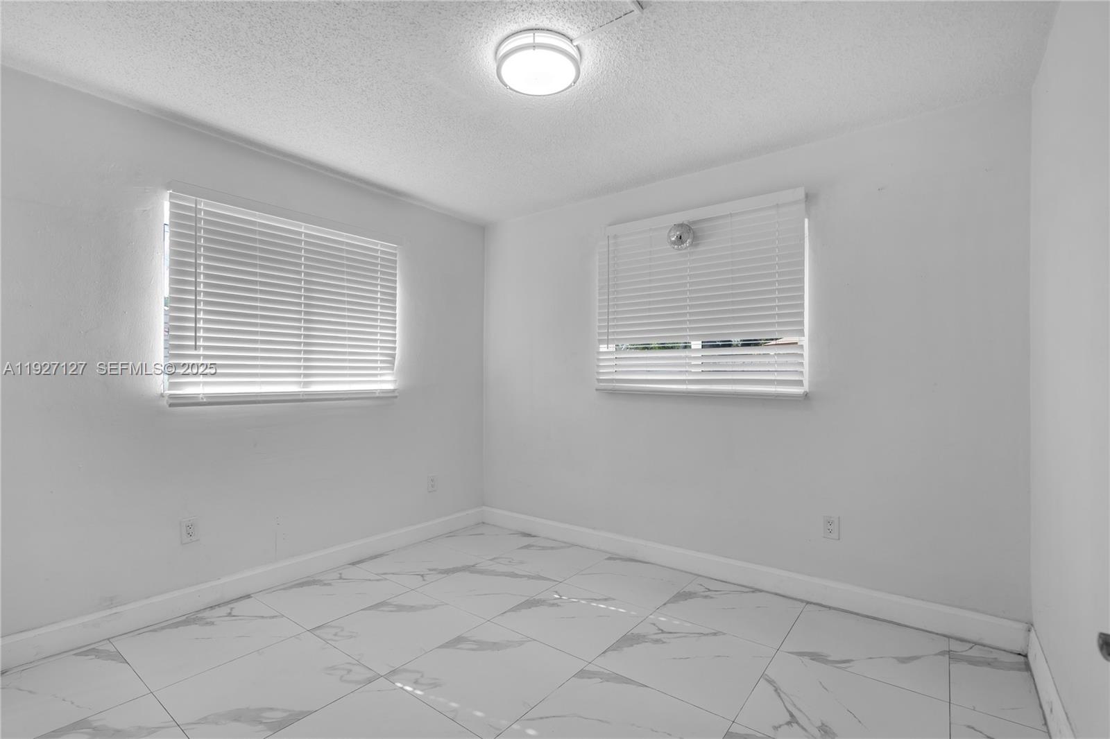 3601 Southwest 2nd Street, Unit 3601 Miami, FL 33135 - Photo 9 of 21 an empty room with windows