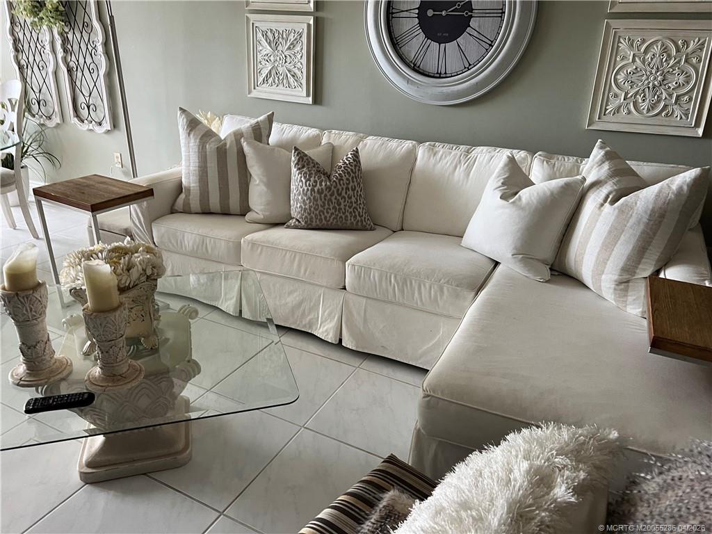 1950 Southwest Palm City Road, Unit 3306 Stuart, FL 34994 - Photo 18 of 49 a living room with furniture and a rug