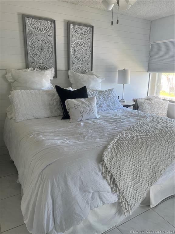 1950 Southwest Palm City Road, Unit 3306 Stuart, FL 34994 - Photo 26 of 49 a bedroom with a bed and a couch
