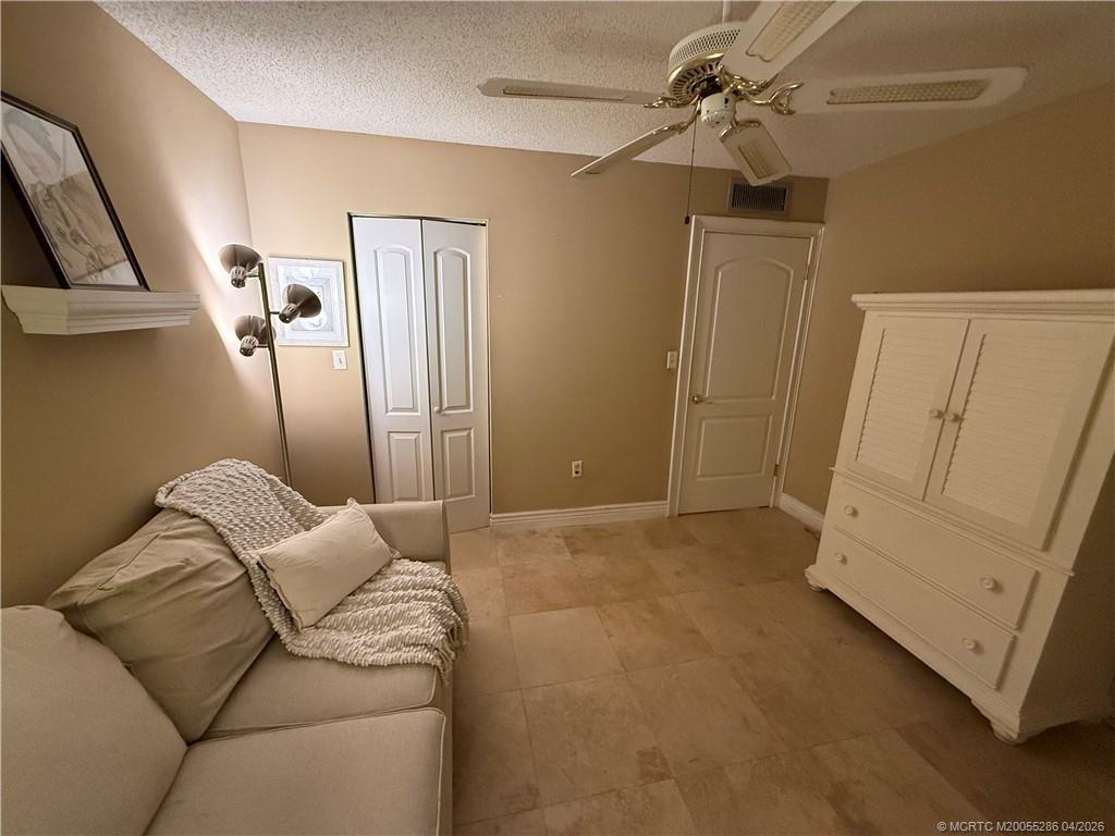 1950 Southwest Palm City Road, Unit 3306 Stuart, FL 34994 - Photo 31 of 49 a living room with furniture and a ceiling fan