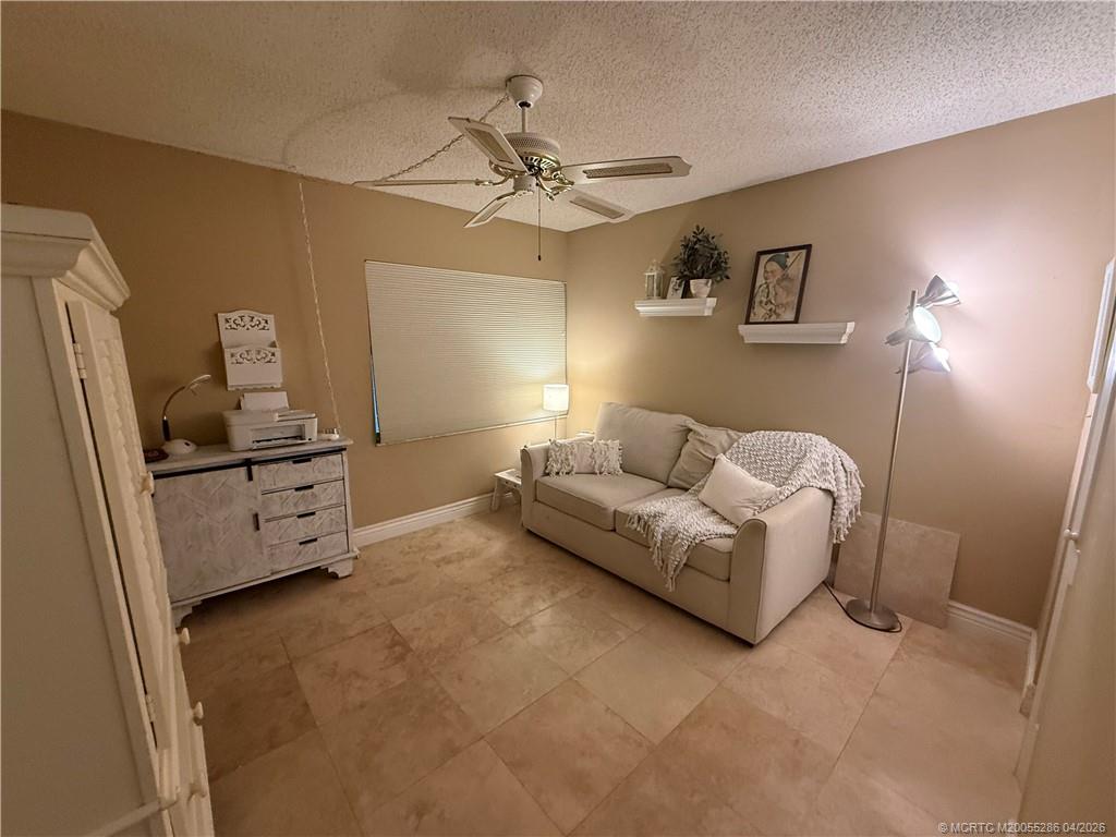 1950 Southwest Palm City Road, Unit 3306 Stuart, FL 34994 - Photo 33 of 49 a living room with furniture and a flat screen tv
