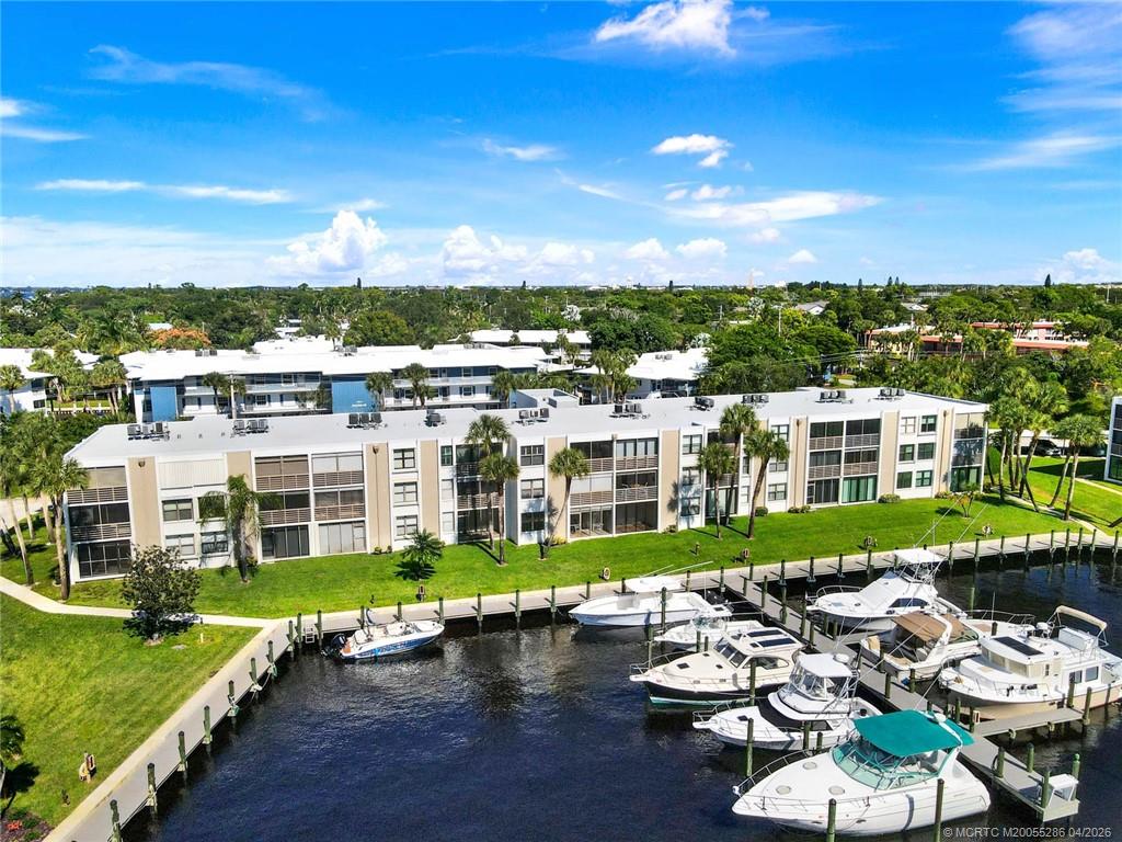 1950 Southwest Palm City Road, Unit 3306 Stuart, FL 34994 - Photo 42 of 49 a view of a lake with a city