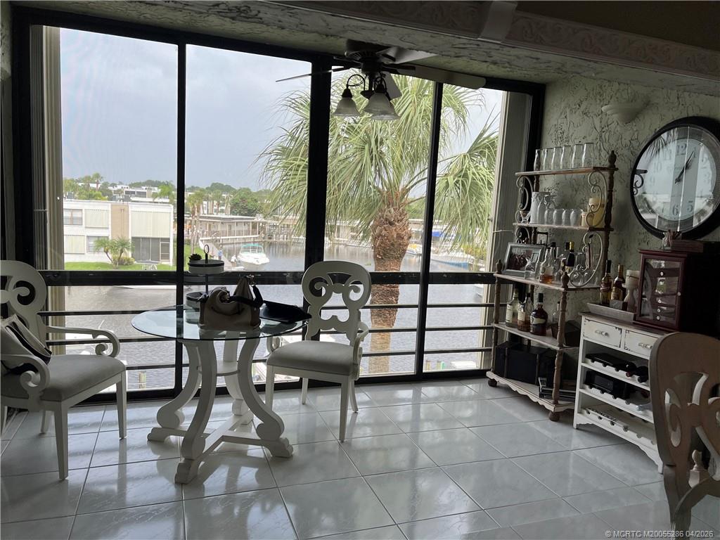 1950 Southwest Palm City Road, Unit 3306 Stuart, FL 34994 - Photo 6 of 49 a room with furniture and a large window