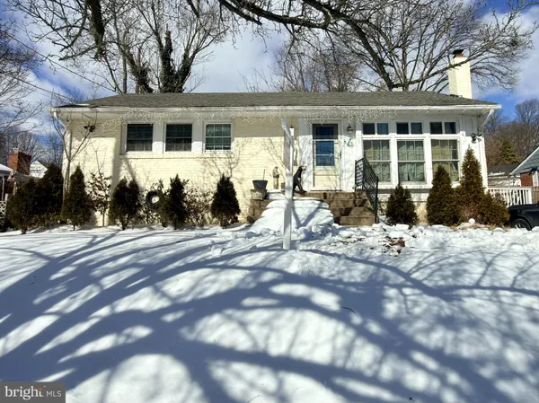 a front view of house with yard outdoor seating and barbeque oven
