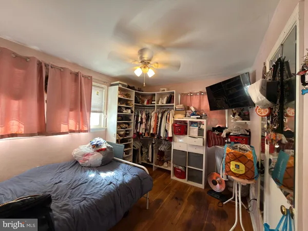 a bed room with a bed and a window