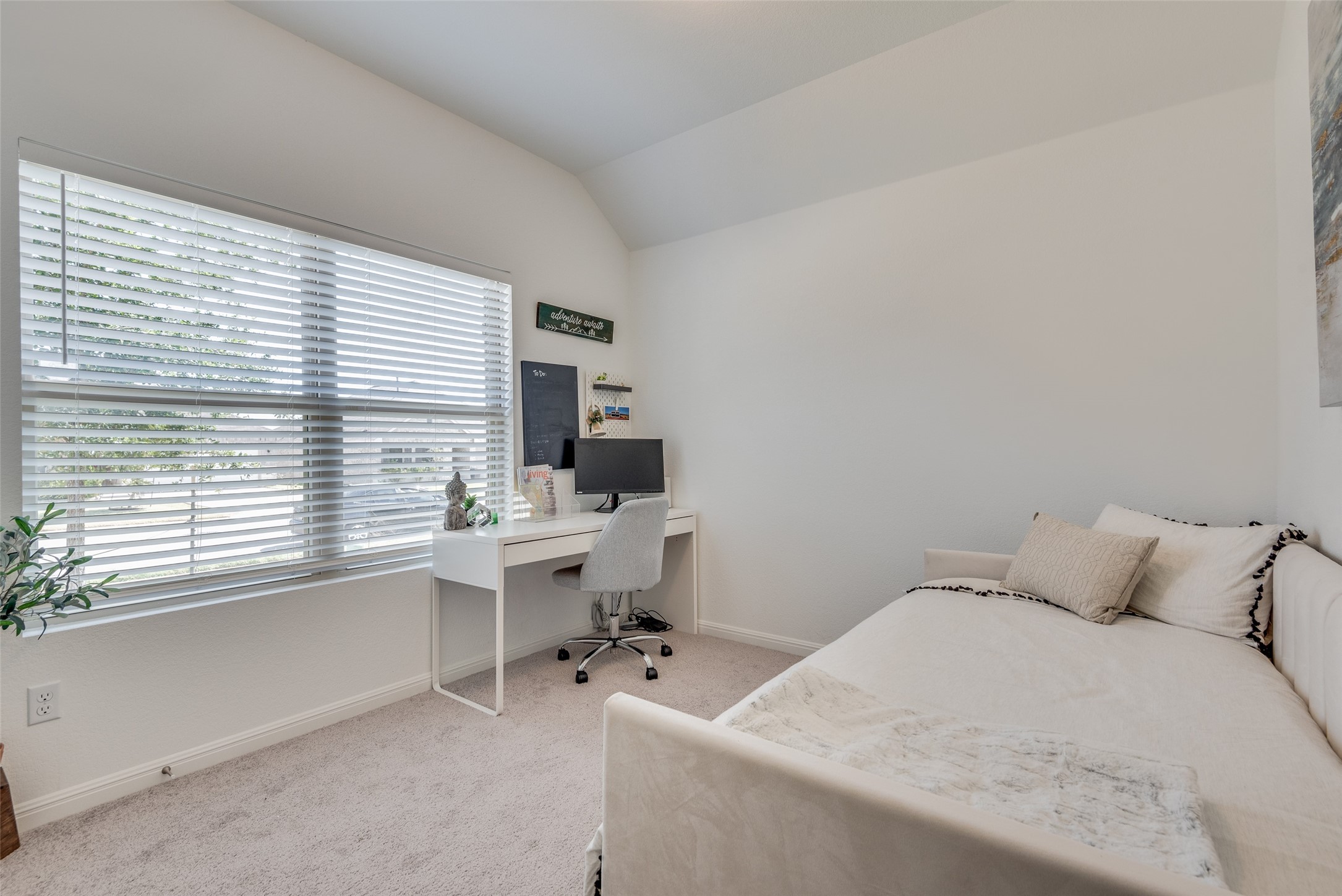 809 San Marcos Street Manor, TX 78653 - Photo 12 of 25 a bedroom with a workspace