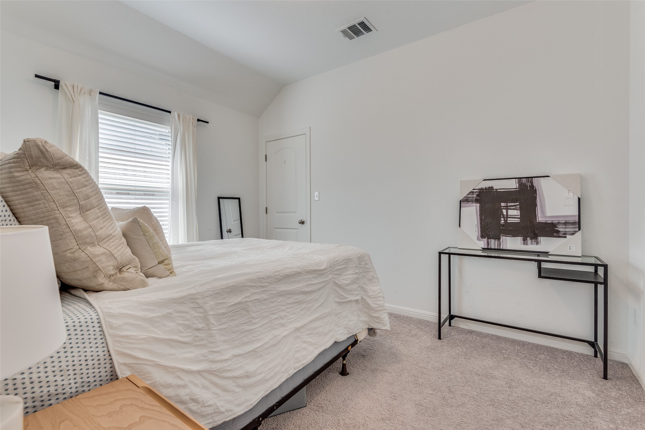 809 San Marcos Street Manor, TX 78653 - Photo 13 of 25 a bedroom with a bed and window