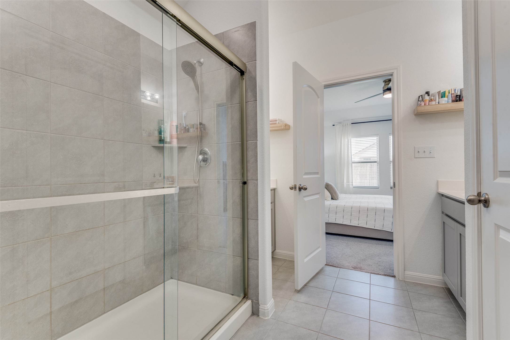 809 San Marcos Street Manor, TX 78653 - Photo 17 of 25 a bathroom with a bathtub and a shower