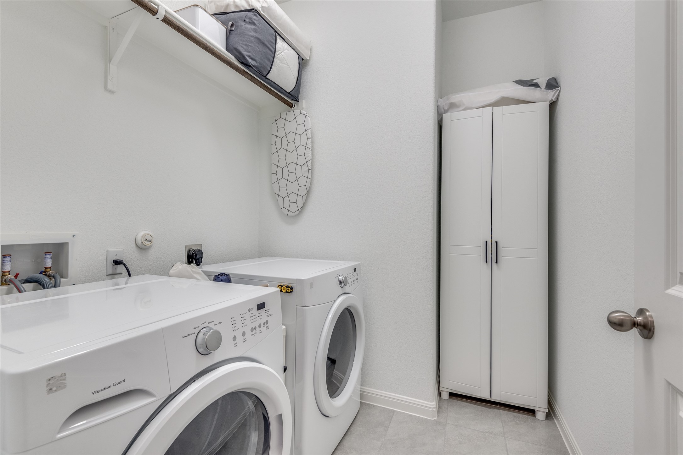809 San Marcos Street Manor, TX 78653 - Photo 20 of 25 a utility room with dryer and washer