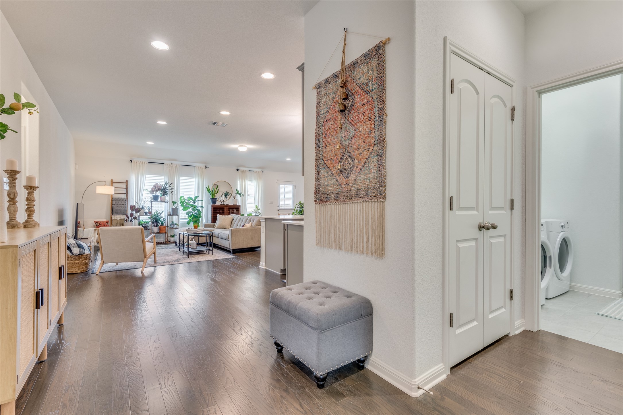 809 San Marcos Street Manor, TX 78653 - Photo 3 of 25 a living room with furniture and a view of kitchen