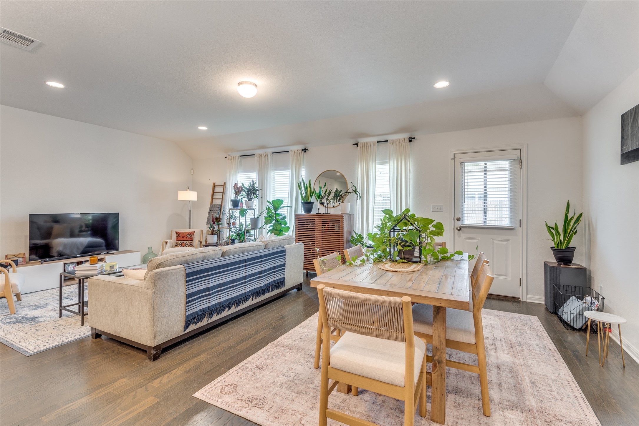 809 San Marcos Street Manor, TX 78653 - Photo 4 of 25 a living room with fireplace furniture and a potted plant