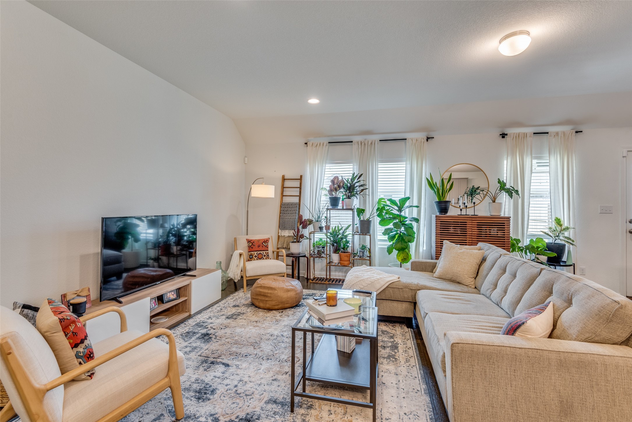 809 San Marcos Street Manor, TX 78653 - Photo 5 of 25 a living room with furniture and a flat screen tv