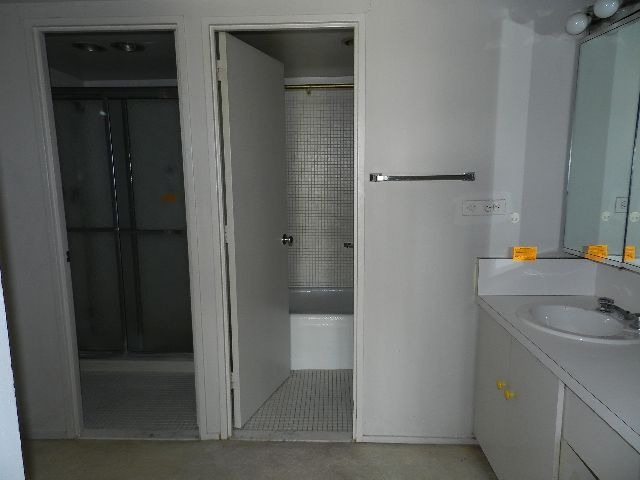 175 East Delaware Place, Unit 7109 Chicago, IL 60611 - Photo 14 of 14 a bathroom with a sink and mirror