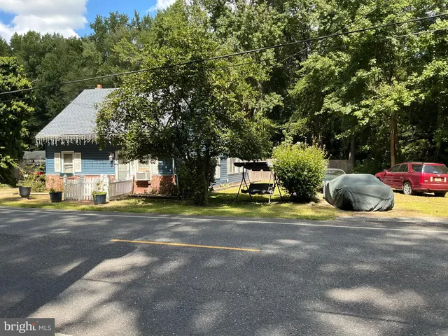 a view of a house with a street