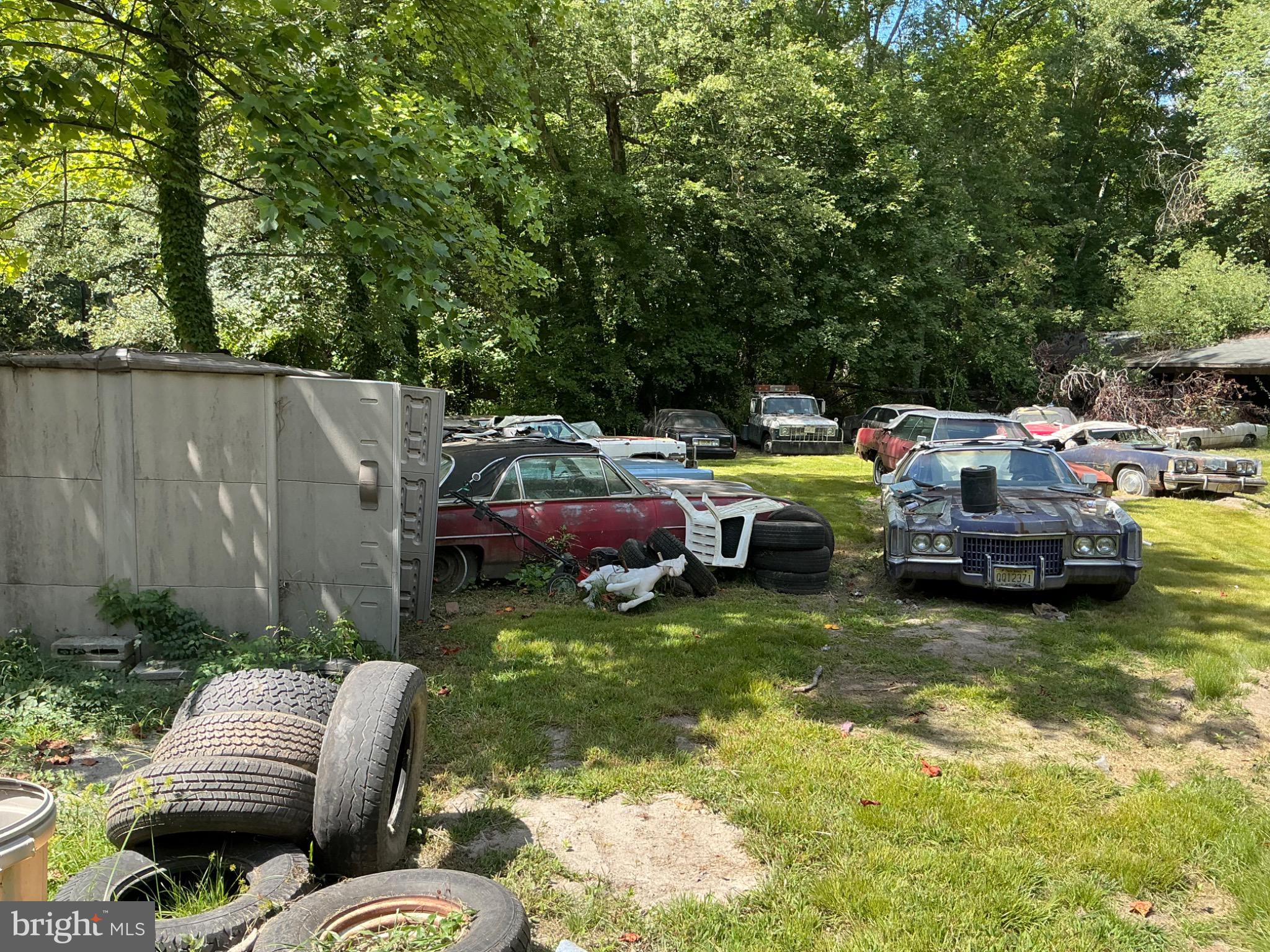 711 Elk Road Monroeville, NJ 08343 - Photo 5 of 6 a couple of cars parked in a yard