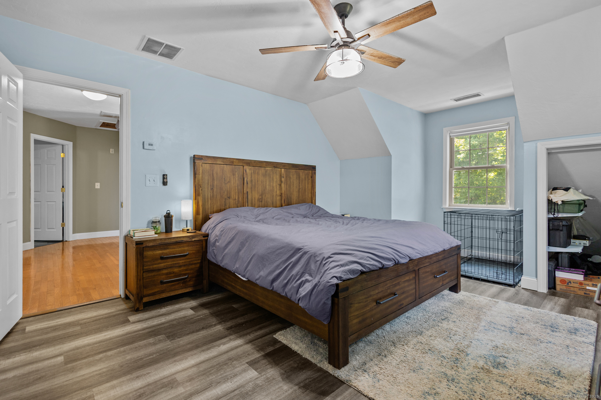 433 Fabyan Road Thompson, CT 06255 - Photo 13 of 39 a bedroom with a bed and a chandelier