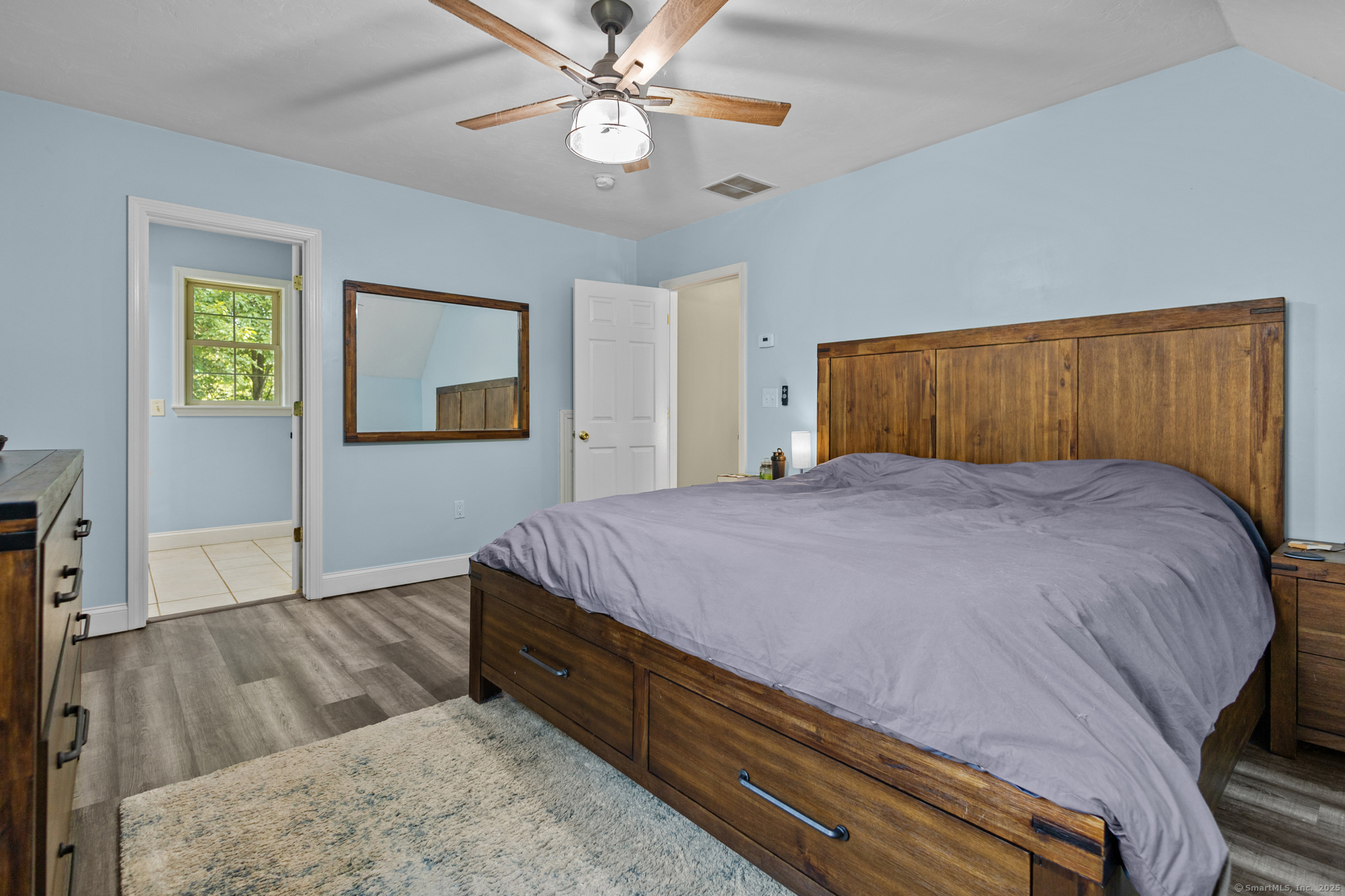 433 Fabyan Road Thompson, CT 06255 - Photo 14 of 39 a bed sitting in a bedroom and wooden floor