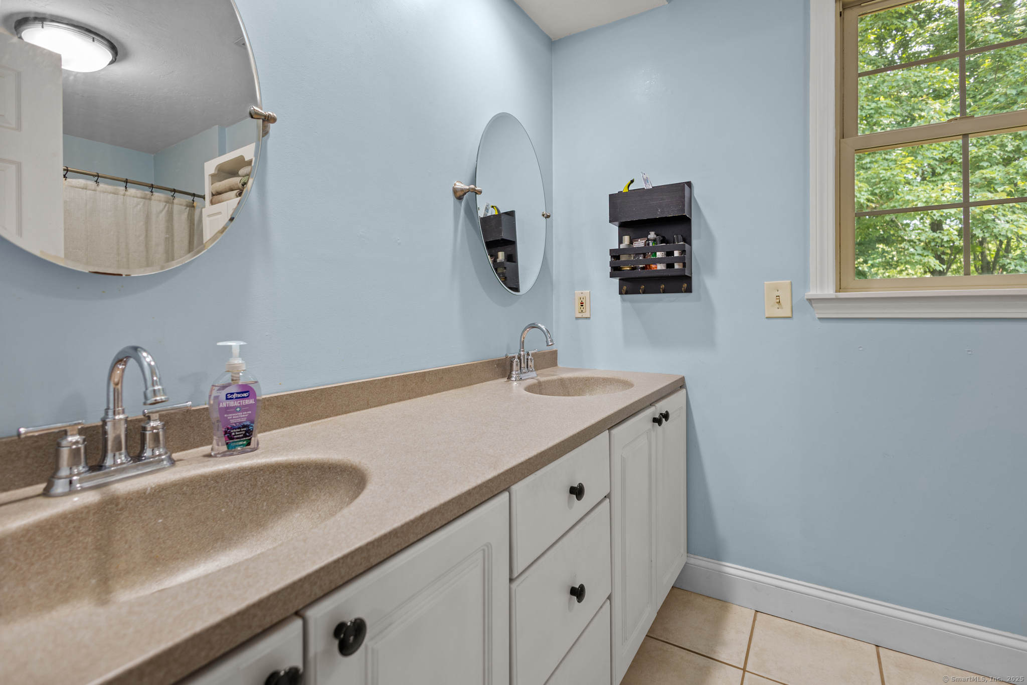 433 Fabyan Road Thompson, CT 06255 - Photo 20 of 39 a bathroom with a double vanity sink and a mirror
