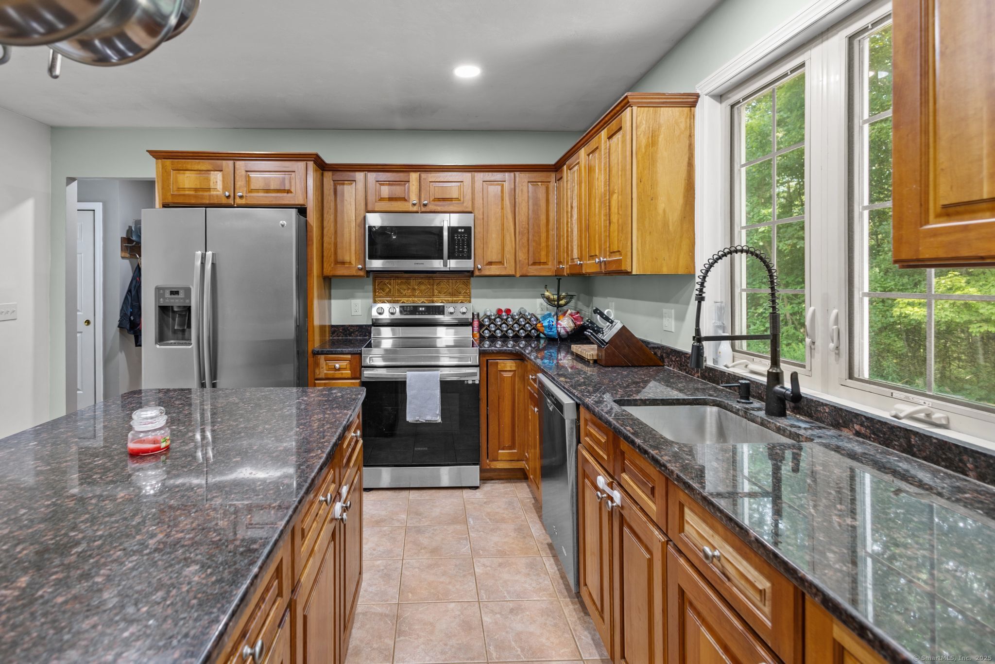 433 Fabyan Road Thompson, CT 06255 - Photo 2 of 39 a kitchen with kitchen island granite countertop a sink appliances cabinets and a counter top space
