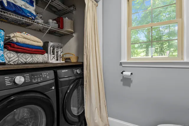 a utility room with dryer and washer