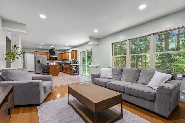 a living room with furniture and a large window